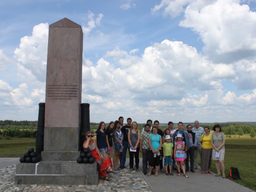 Students posing near a war monument